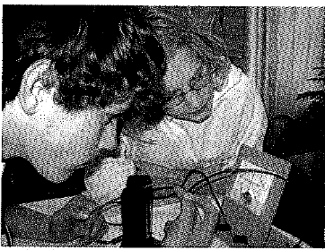 Chapter 37, Problem 23A, When Tim pushes the wire down between the poles of the magnet, the galvanometer registers a pulse. 